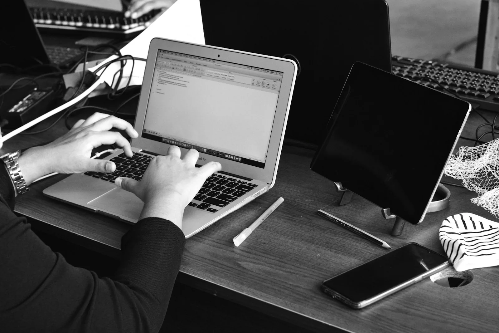 Website designer working at a monitor in Dhaka